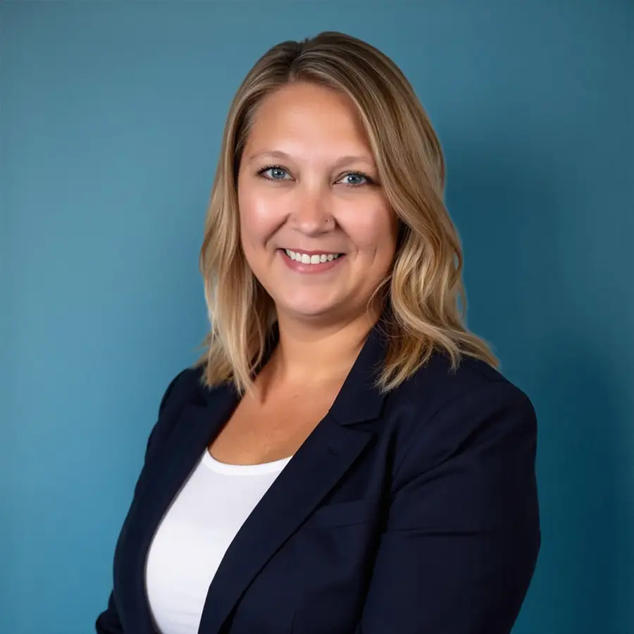Professional headshot of a Driver Advantage team member wearing a navy blazer and white shirt, representing the company’s commitment to professional and personalized service.